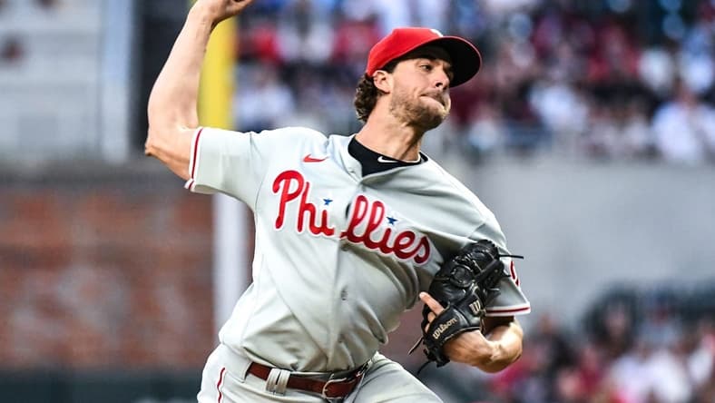 Sep 17, 2022; Cumberland, Georgia, USA; Philadelphia Phillies starting pitcher Aaron Nola (27) throws a strike in the first inning against the Atlanta Braves at Truist Park. Mandatory Credit: Larry Robinson-USA TODAY Sports