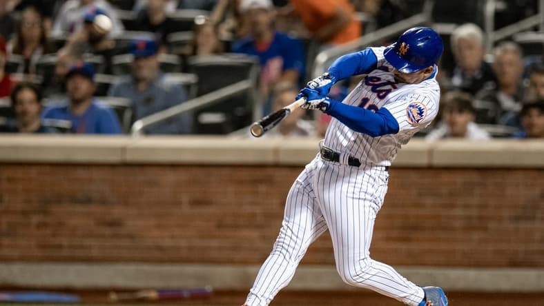 Sep 17, 2022; New York City, New York, USA; New York Mets third baseman Eduardo Escobar (10) hits a three run home run against the Pittsburgh Pirates during the second inning at Citi Field. Mandatory Credit: John Jones-USA TODAY Sports