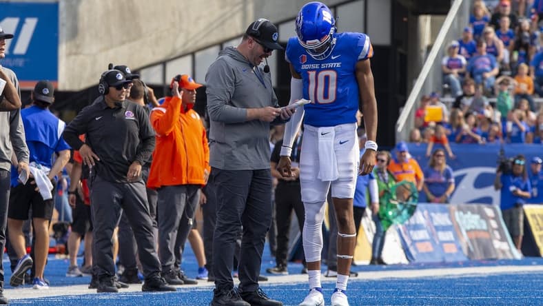 Sep 17, 2022; Boise, Idaho, USA; Boise State Broncos quarterback Taylen Green (10) confers with Boise State offensive coordinator Tim Plough during the second half of action  at Albertsons Stadium versus Tennessee Martin Skyhawks . Boise State defeats Tennessee Martin 30-7. Mandatory Credit: Brian Losness-USA TODAY Sports