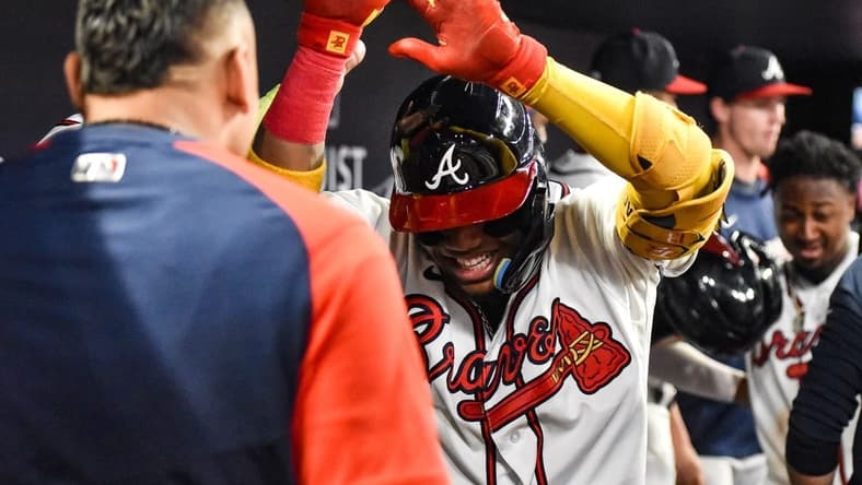 Sep 17, 2022; Cumberland, Georgia, USA; Atlanta Braves right fielder Ronald Acuna Jr. (13) celebrates after hitting a two-run home run against the Philadelphia Phillies in the third inning at Truist Park. Mandatory Credit: Larry Robinson-USA TODAY Sports