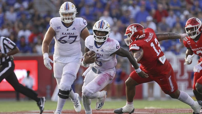 Sep 17, 2022; Houston, Texas, USA; Kansas Jayhawks quarterback Jalon Daniels (6) runs with the ball during the third quarter against the Houston Cougars at TDECU Stadium. Mandatory Credit: Troy Taormina-USA TODAY Sports