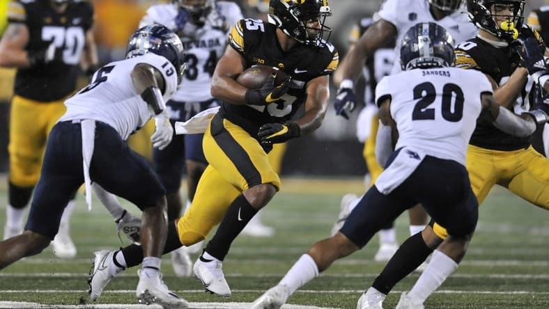 Sep 17, 2022; Iowa City, Iowa, USA; Iowa Hawkeyes running back Gavin Williams (25) runs the ball against the Nevada Wolf Pack during the second quarter at Kinnick Stadium. Mandatory Credit: Jeffrey Becker-USA TODAY Sports