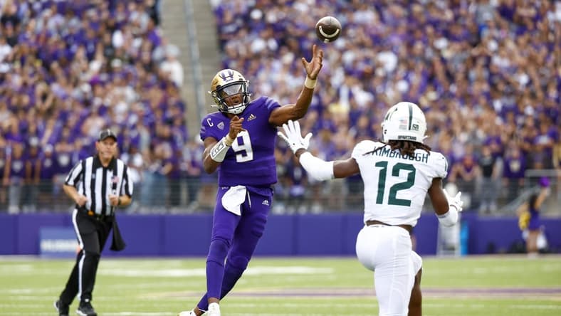 Sep 17, 2022; Seattle, Washington, USA; Washington Huskies quarterback Michael Penix Jr. (9) throws a touchdown pass against the Michigan State Spartans during the second quarter at Alaska Airlines Field at Husky Stadium. Mandatory Credit: Joe Nicholson-USA TODAY Sports