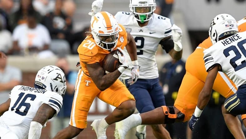 Tennessee running back Jaylen Wright (20) runs between Akron defenders during Tennessee  s football game against Akron in Neyland Stadium in Knoxville, Tenn., on Saturday, Sept. 17, 2022.

Kns Ut Akron Football
