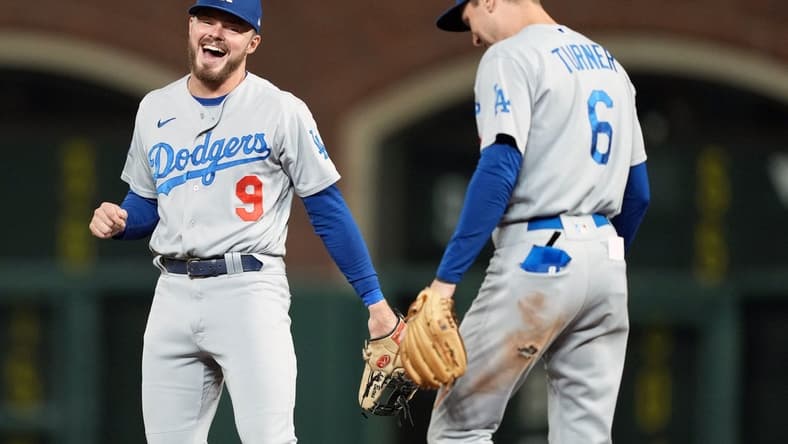 Sep 17, 2022; San Francisco, California, USA; /Los Angeles Dodgers second baseman Gavin Lux (9) and shortstop Trea Turner (6) talk during the fourth inning against the San Francisco Giants at Oracle Park. Mandatory Credit: Darren Yamashita-USA TODAY Sports