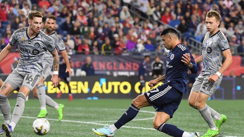 Sep 17, 2022; Foxborough, Massachusetts, USA; New England Revolution forward Gustavo Bou (7) shoots against the CF Montreal during the second half at Gillette Stadium. Mandatory Credit: Eric Canha-USA TODAY Sports