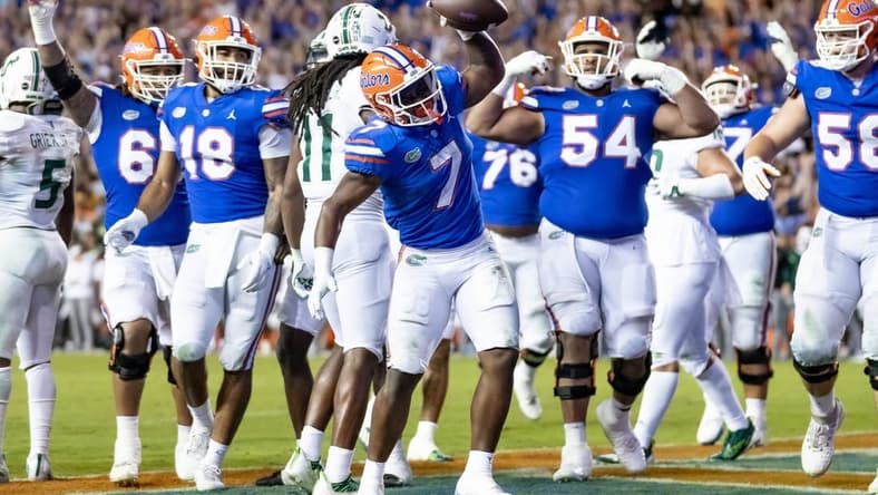Florida Gators running back Trevor Etienne (7) rushes with the ball for a touchdown during the second half against the South Florida Bulls at Steve Spurrier Field at Ben Hill Griffin Stadium in Gainesville, FL on Saturday, September 17, 2022. [Matt Pendleton/Gainesville Sun]

Ncaa Football Florida Gators Vs South Florida Bulls