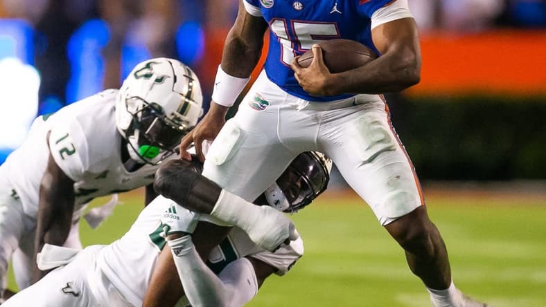 Florida Gators quarterback Anthony Richardson (15) is brought down in the second half against the Bulls at Steve Spurrier Field at Ben Hill Griffin Stadium in Gainesville, FL on Saturday, September 17, 2022. Florida won 31-28 [Doug Engle/Gainesville Sun]

Ncaa Football Florida Gators Vs Usf Bulls