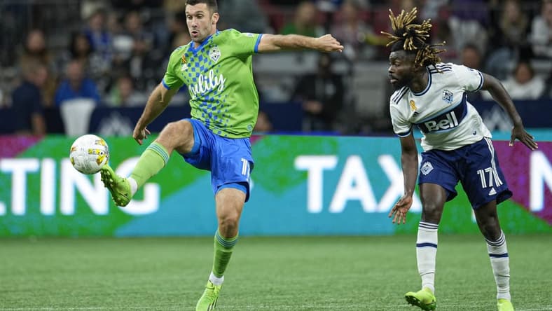 Sep 17, 2022; Vancouver, British Columbia, CAN; Seattle Sounders midfielder Albert Rusnak (11) wins control of the ball while battling with Vancouver Whitecaps midfielder Leonard Owusu (17) in the second half at BC Place. Mandatory Credit: Bob Frid-USA TODAY Sports