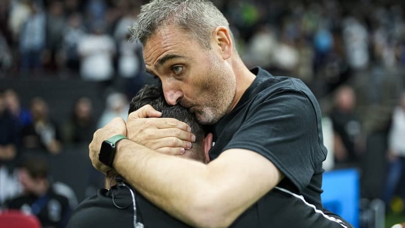 Sep 17, 2022; Vancouver, British Columbia, CAN; Vancouver Whitecaps head coach Vanni Sartini embraces a member of the coaching staff while celebrating after defeating the Seattle Sounders 2-1 at BC Place. Mandatory Credit: Bob Frid-USA TODAY Sports