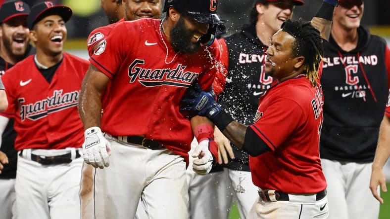 Sep 17, 2022; Cleveland, Ohio, USA; Cleveland Guardians shortstop Amed Rosario, middle, celebrates with teammates after hitting an RBI single to win the game during the fifteenth inning against the Minnesota Twins at Progressive Field. Mandatory Credit: Ken Blaze-USA TODAY Sports