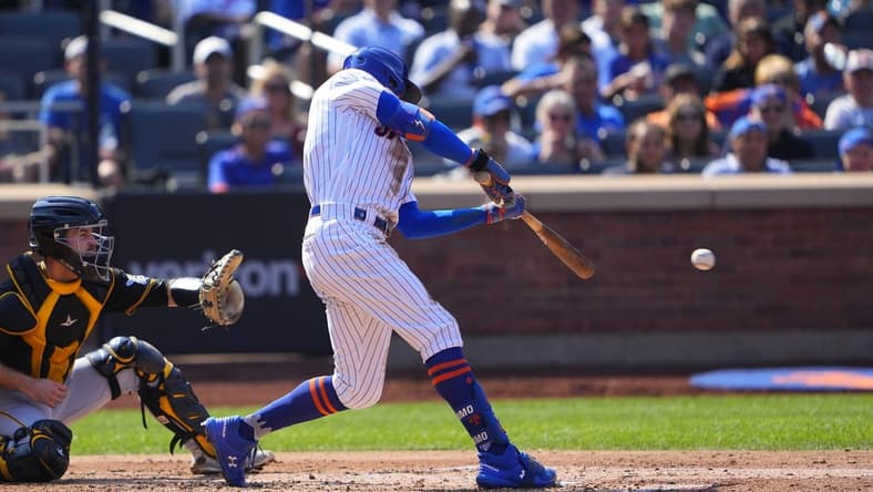 Sep 18, 2022; New York City, New York, USA; New York Mets center fielder Brandon Nimmo (9) hits a single against the Pittsburgh Pirates during the second inning at Citi Field. Mandatory Credit: Gregory Fisher-USA TODAY Sports