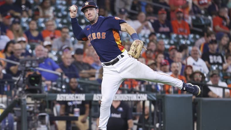 Sep 18, 2022; Houston, Texas, USA; Houston Astros third baseman Alex Bregman (2) throws to first base on a play during the fifth inning against the Oakland Athletics at Minute Maid Park. Mandatory Credit: Troy Taormina-USA TODAY Sports