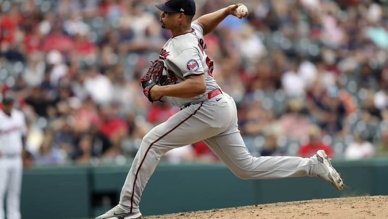 Sep 18, 2022; Cleveland, Ohio, USA; Minnesota Twins  closer Jhoan Duran (59) pitches against the Cleveland Guardians in the ninth inning at Progressive Field. Mandatory Credit: Aaron Josefczyk-USA TODAY Sports