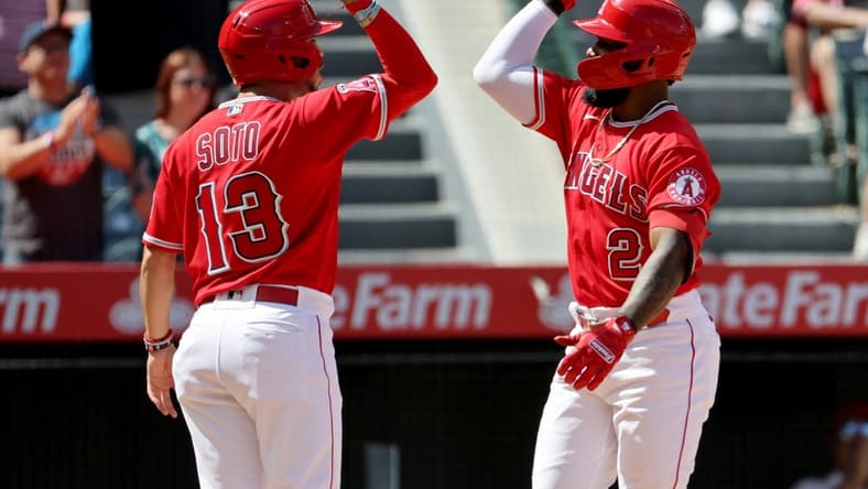 Sep 18, 2022; Anaheim, California, USA; Los Angeles Angels third baseman Luis Rengifo (2) celebrates with shortstop Livan Soto (13) after hitting a second home run of the game during the third inning against the Seattle Mariners at Angel Stadium. Mandatory Credit: Kiyoshi Mio-USA TODAY Sports