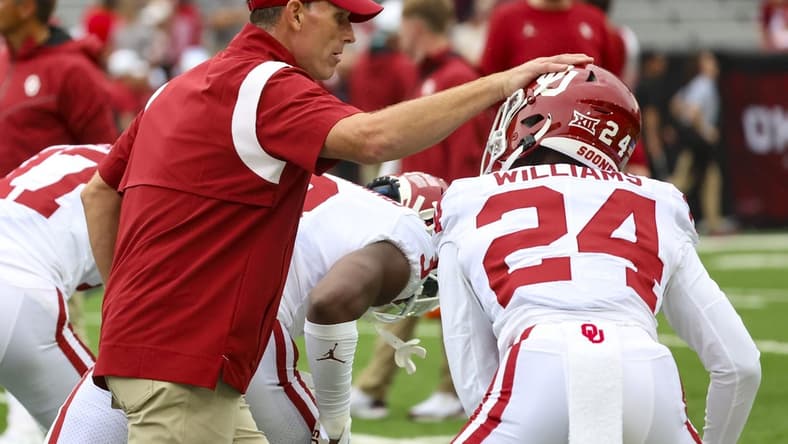 Sep 17, 2022; Lincoln, Nebraska, USA;  Oklahoma Sooners head coach Brent Venables greets Oklahoma Sooners defensive back Gentry Williams (24) before the game against the Nebraska Cornhuskers at Memorial Stadium. Mandatory Credit: Kevin Jairaj-USA TODAY Sports