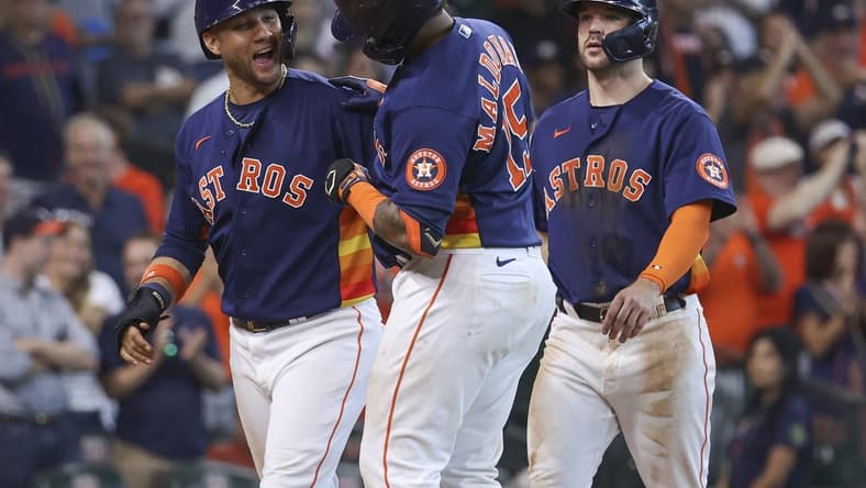 Sep 18, 2022; Houston, Texas, USA; Houston Astros catcher Martin Maldonado (15) celebrates with first baseman Yuli Gurriel (10) after hitting a home run during the seventh inning against the Oakland Athletics at Minute Maid Park. Mandatory Credit: Troy Taormina-USA TODAY Sports
