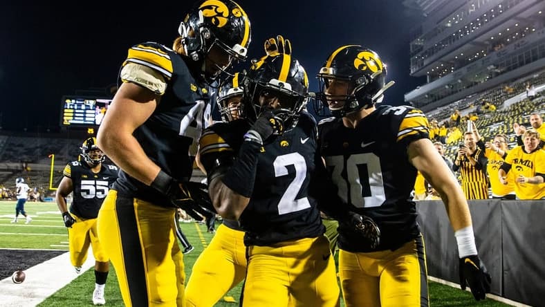 Iowa defensive back Terry Roberts, center, celebrates with teammates Max Llewellyn, left, and Quinn Schulte after intercepting during a NCAA football game against Nevada, Sunday, Sept. 18, 2022, at Kinnick Stadium in Iowa City, Iowa. The play was overturned due to a penalty against Iowa.

220917 Nevada Iowa Fb 068 Jpg