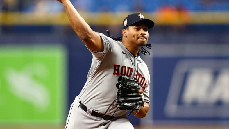 Sep 19, 2022; St. Petersburg, Florida, USA; Houston Astros starting pitcher Luis Garcia (77) throws a pitch against the Tampa Bay Rays in the first inning at Tropicana Field. Mandatory Credit: Nathan Ray Seebeck-USA TODAY Sports