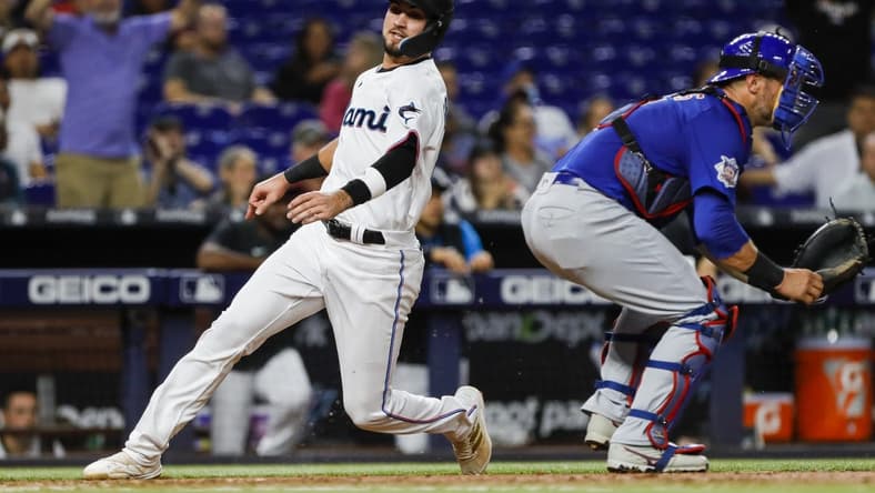 Sep 19, 2022; Miami, Florida, USA; Miami Marlins third baseman Jordan Groshans (65) scores a run in the fourth inning against the Chicago Cubs at loanDepot Park. Mandatory Credit: Sam Navarro-USA TODAY Sports
