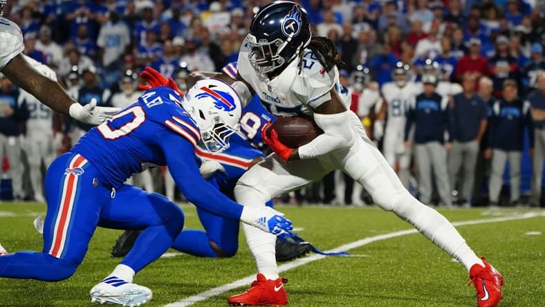 Sep 19, 2022; Orchard Park, New York, USA; Buffalo Bills linebacker Von Miller (40) tackles Tennesse Titans running back Derrick Henry (22) during the first half at Highmark Stadium. Mandatory Credit: Gregory Fisher-USA TODAY Sports