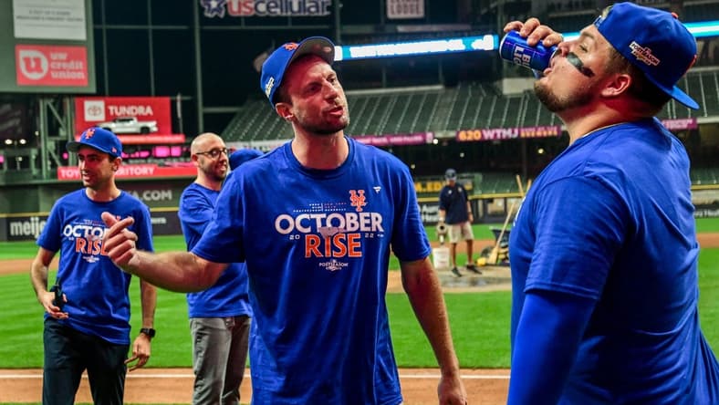 Sep 19, 2022; Milwaukee, Wisconsin, USA; New York Mets pitcher Max Scherzer (21) celebrates with designated hitter Daniel Vogelbach (32) after the Mets clinched a playoff spot by beating the Milwaukee Brewers at American Family Field. Mandatory Credit: Benny Sieu-USA TODAY Sports