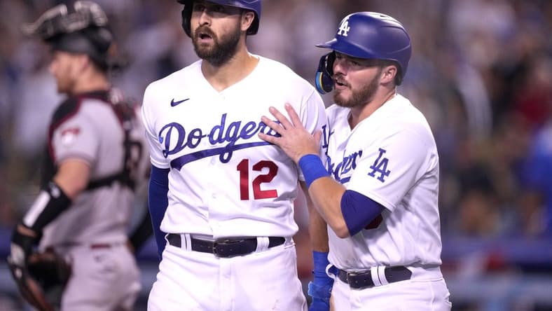 Sep 19, 2022; Los Angeles, California, USA; Los Angeles Dodgers left fielder Joey Gallo (12) and second baseman Gavin Lux (9) celebrate after scoring in the fourth inning against the Arizona Diamondbacks at Dodger Stadium. Mandatory Credit: Kirby Lee-USA TODAY Sports