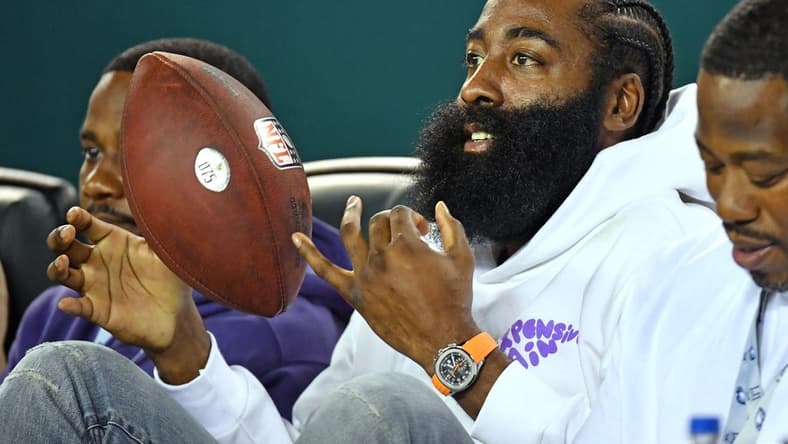 Sep 19, 2022; Philadelphia, Pennsylvania, USA; Philadelphia 76ers guard James Harden with the football that was given to him from Philadelphia Eagles cornerback Darius Slay (2) after he intercepted a pass against the Minnesota Vikings Lincoln Financial Field. Mandatory Credit: Eric Hartline-USA TODAY Sports