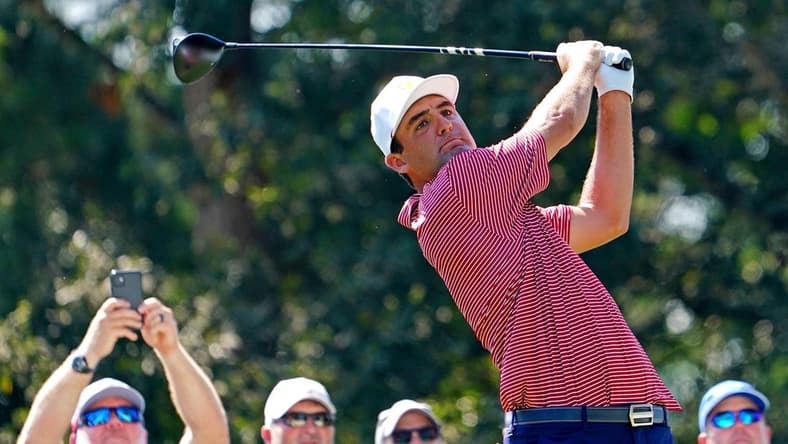 Sep 20, 2022; Charlotte, North Carolina, USA; Team USA golfer Scottie Scheffler plays his shot from the 15th tee during a practice day for the Presidents Cup golf tournament at Quail Hollow Club. Mandatory Credit: Peter Casey-USA TODAY Sports