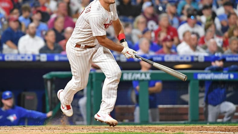 Sep 20, 2022; Philadelphia, Pennsylvania, USA; Philadelphia Phillies catcher J.T. Realmuto (10) hits an RBI single against the Toronto Blue Jays during the fifth inning at Citizens Bank Park. Mandatory Credit: Eric Hartline-USA TODAY Sports