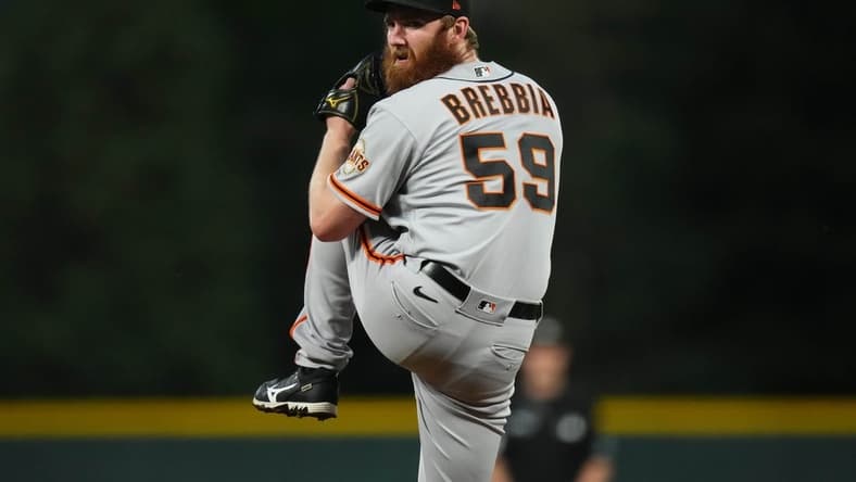Sep 20, 2022; Denver, Colorado, USA; San Francisco Giants relief pitcher John Brebbia (59) pitches in the first inning against the Colorado Rockies at Coors Field. Mandatory Credit: Ron Chenoy-USA TODAY Sports