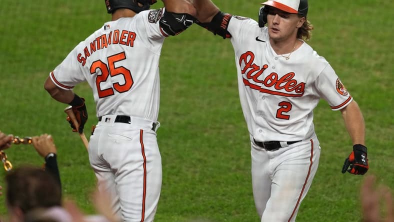 Sep 20, 2022; Baltimore, Maryland, USA; Baltimore Orioles third baseman Gunnar Henderson (2) greeted by outfielder Anthony Santander (25) after his two-run home run in the seventh inning against the Detroit Tigers at Oriole Park at Camden Yards. Mandatory Credit: Mitch Stringer-USA TODAY Sports
