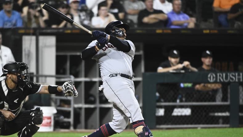Sep 20, 2022; Chicago, Illinois, USA; Cleveland Guardians first baseman Josh Naylor (22) hits an RBI single during the tenth inning against the Chicago White Sox at Guaranteed Rate Field. Mandatory Credit: Matt Marton-USA TODAY Sports