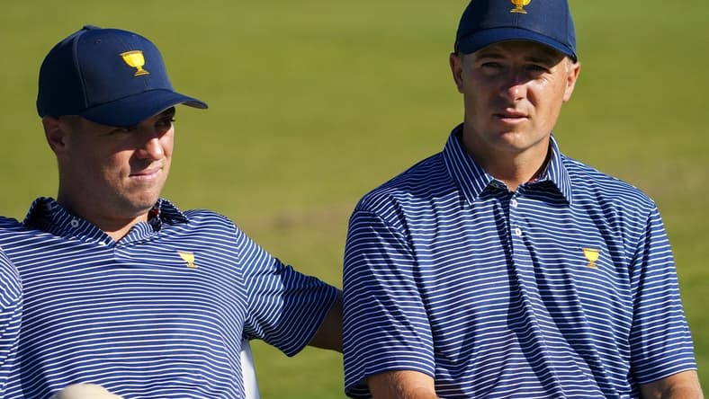 Sep 21, 2022; Charlotte, North Carolina, USA; Team USA golfer Justin Thomas (left) and Team USA golfer Jordan Spieth (right) sit before the team photo during a practice day for the Presidents Cup golf tournament at Quail Hollow Club. Mandatory Credit: Peter Casey-USA TODAY Sports