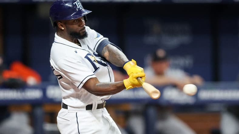 Sep 21, 2022; St. Petersburg, Florida, USA; Tampa Bay Rays left fielder Randy Arozarena (56) hits a single against the Houston Astros in the sixth inning at Tropicana Field. Mandatory Credit: Nathan Ray Seebeck-USA TODAY Sports
