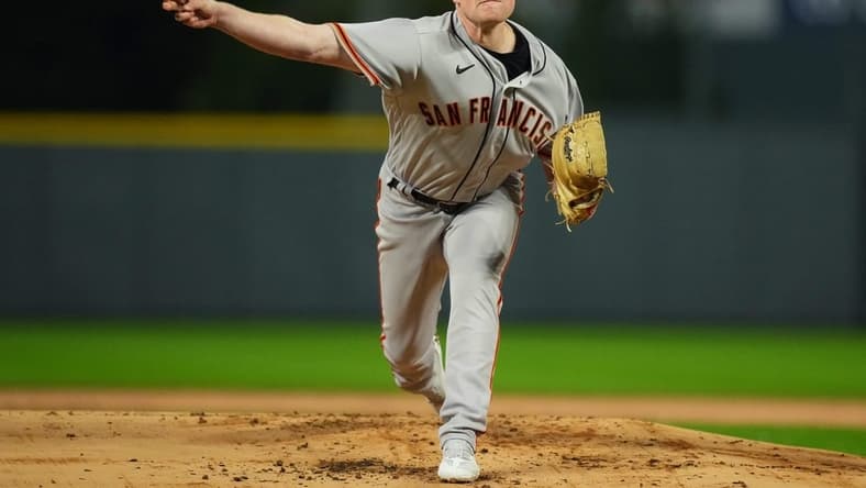 Sep 21, 2022; Denver, Colorado, USA; San Francisco Giants starting pitcher Logan Webb (62) pitches in the first inning against the Colorado Rockies at Coors Field. Mandatory Credit: Ron Chenoy-USA TODAY Sports