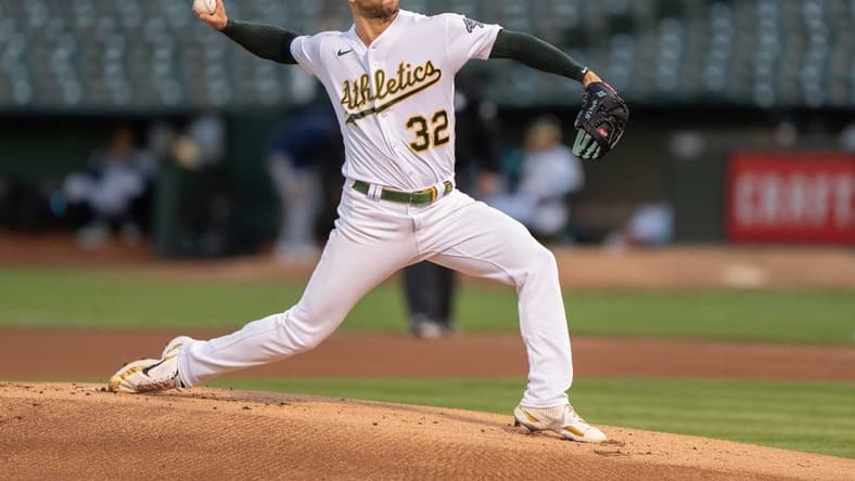 Sep 21, 2022; Oakland, California, USA; Oakland Athletics starting pitcher James Kaprielian (32) pitches during the first inning against the Seattle Mariners at RingCentral Coliseum. Mandatory Credit: Stan Szeto-USA TODAY Sports
