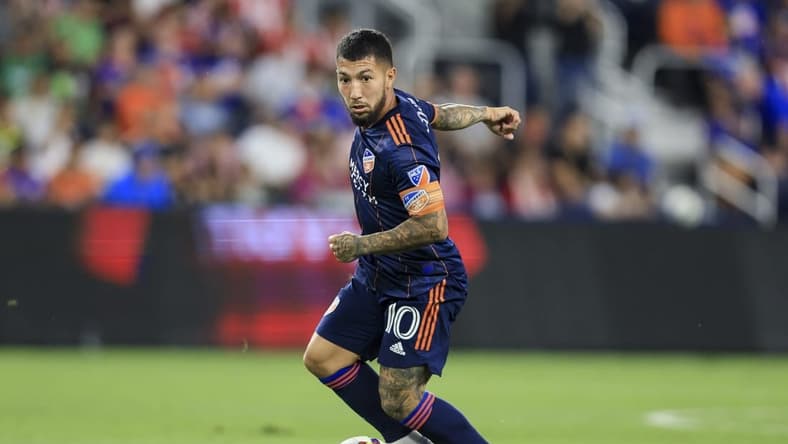 Sep 21, 2022; Cincinnati, OH, USA;  FC Cincinnati midfielder Luciano Acosta (10) carries the ball against Club Deportivo Guadalajara in the second half at TQL Stadium. Mandatory Credit: Aaron Doster-USA TODAY Sports