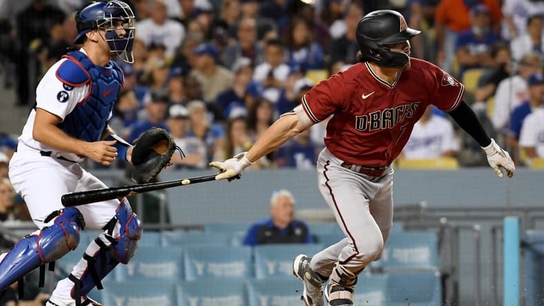 Sep 21, 2022; Los Angeles, California, USA; Arizona Diamondbacks left fielder Corbin Carroll (7) hits a RBI double during the 4th inning against the Los Angeles Dodgers at Dodger Stadium. Mandatory Credit: Richard Mackson-USA TODAY Sports