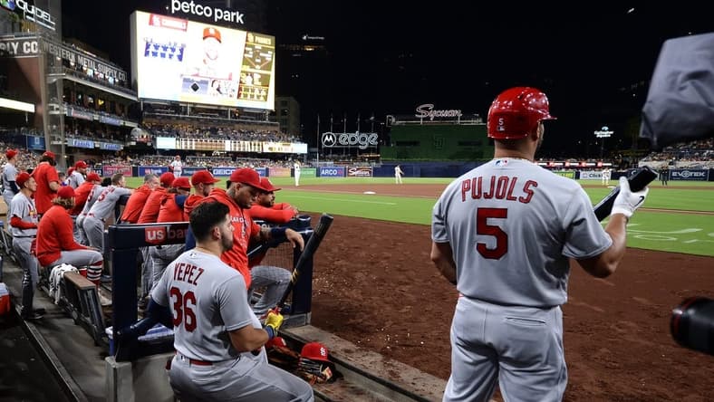 Sep 21, 2022; San Diego, California, USA; St. Louis Cardinals designated hitter Albert Pujols (5) and right fielder Juan Yepez (36) look on from the dugout during the fourth inning against the San Diego Padres at Petco Park. Mandatory Credit: Orlando Ramirez-USA TODAY Sports