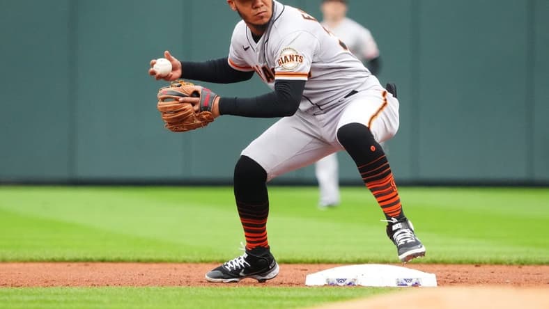 Sep 22, 2022; Denver, Colorado, USA; San Francisco Giants second baseman Thairo Estrada (39) fields the ball in the first inning against the Colorado Rockies at Coors Field. Mandatory Credit: Ron Chenoy-USA TODAY Sports