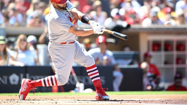 Sep 22, 2022; San Diego, California, USA; St. Louis Cardinals designated hitter Albert Pujols (5) hits a single against the San Diego Padres during the second inning at Petco Park. Mandatory Credit: Orlando Ramirez-USA TODAY Sports