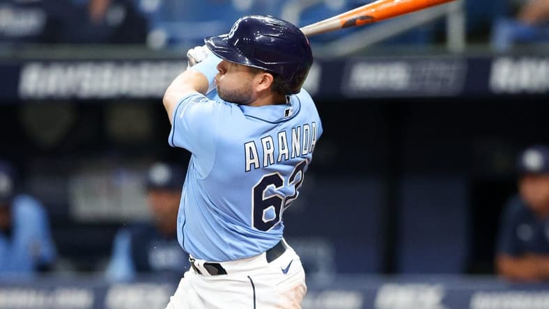 Sep 22, 2022; St. Petersburg, Florida, USA; Tampa Bay Rays third baseman Jonathan Aranda (62) hits a home run against the Toronto Blue Jays in the first inning at Tropicana Field. Mandatory Credit: Nathan Ray Seebeck-USA TODAY Sports