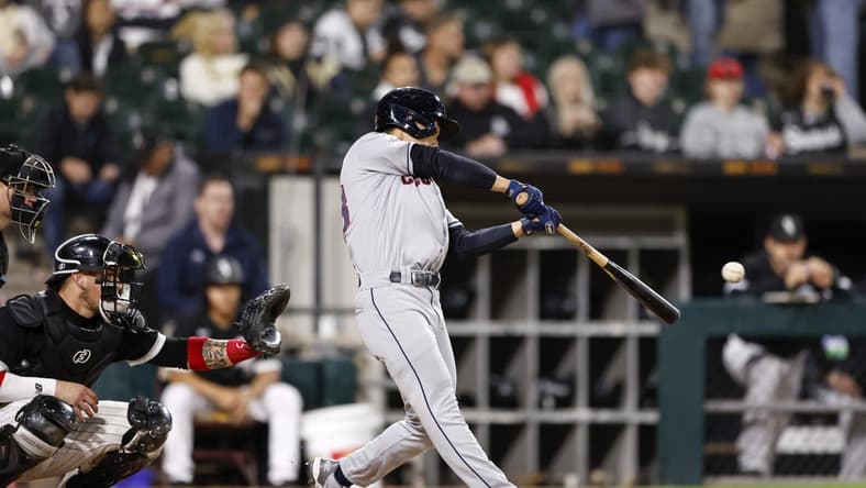 Sep 22, 2022; Chicago, Illinois, USA; Cleveland Guardians left fielder Steven Kwan (38) hits an RBI triple against the Chicago White Sox during the fifth inning at Guaranteed Rate Field. Mandatory Credit: Kamil Krzaczynski-USA TODAY Sports