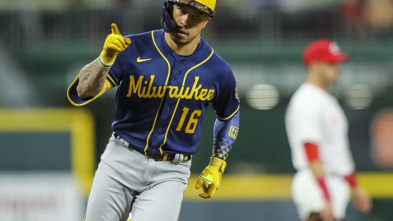 Sep 22, 2022; Cincinnati, Ohio, USA; Milwaukee Brewers second baseman Kolten Wong (16) reacts after hitting a two-run home run in the sixth inning against the Cincinnati Reds at Great American Ball Park. Mandatory Credit: Katie Stratman-USA TODAY Sports