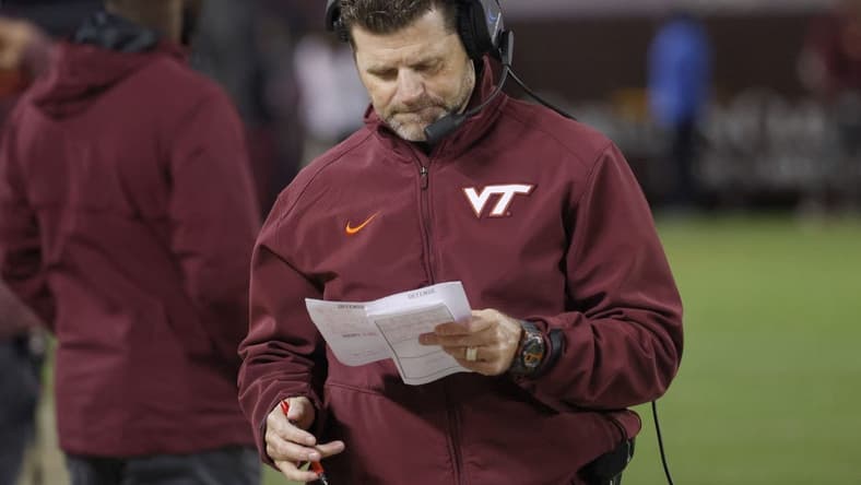 Sep 22, 2022; Blacksburg, Virginia, USA; Virginia Tech Hokies head coach Brent Pry checks his charts during the second half against the West Virginia Mountaineers at Lane Stadium. Mandatory Credit: Reinhold Matay-USA TODAY Sports