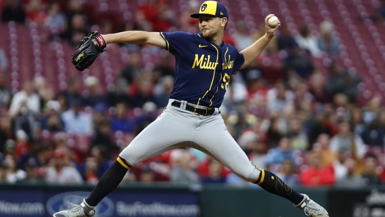 Sep 23, 2022; Cincinnati, Ohio, USA; Milwaukee Brewers starting pitcher Eric Lauer (51) throws a pitch against the Cincinnati Reds during the first inning at Great American Ball Park. Mandatory Credit: David Kohl-USA TODAY Sports