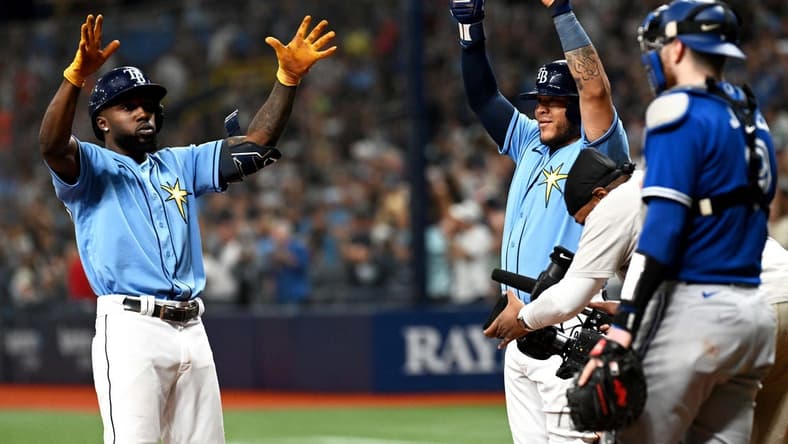 Sep 23, 2022; St. Petersburg, Florida, USA; Tampa Bay Rays left fielder Randy Arozarena (left) and designated hitter Harold Ramirez (43) celebrate after scoring in the fifth inning against the Toronto Blue Jays at Tropicana Field. Mandatory Credit: Jonathan Dyer-USA TODAY Sports