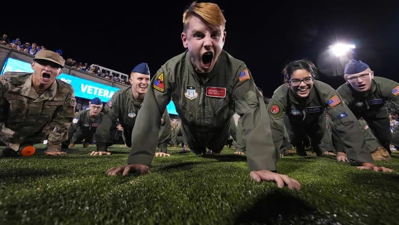 Sep 23, 2022; Colorado Springs, Colorado, USA; Air Force cadets finish pushups following a score in the second quarter against the Nevada Wolf Pack at Falcon Stadium. Mandatory Credit: Ron Chenoy-USA TODAY Sports