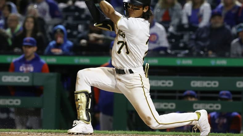 Sep 23, 2022; Pittsburgh, Pennsylvania, USA; Pittsburgh Pirates second baseman Ji-hwan Bae (71) hits a single against the Chicago Cubs during the ninth inning at PNC Park. It was the first MLB hit by Bae. Mandatory Credit: Charles LeClaire-USA TODAY Sports